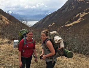 Hannah with friend with backpacks in mountains