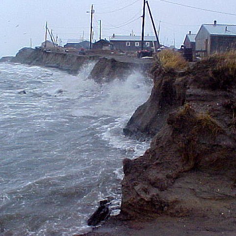 Photos of waves watching against an eroding wall of dirt with house precariously close to the edge.