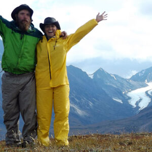 Michelle and partner Ranger B wave from a ridge in Denali National Park. A bittersweet farewell.