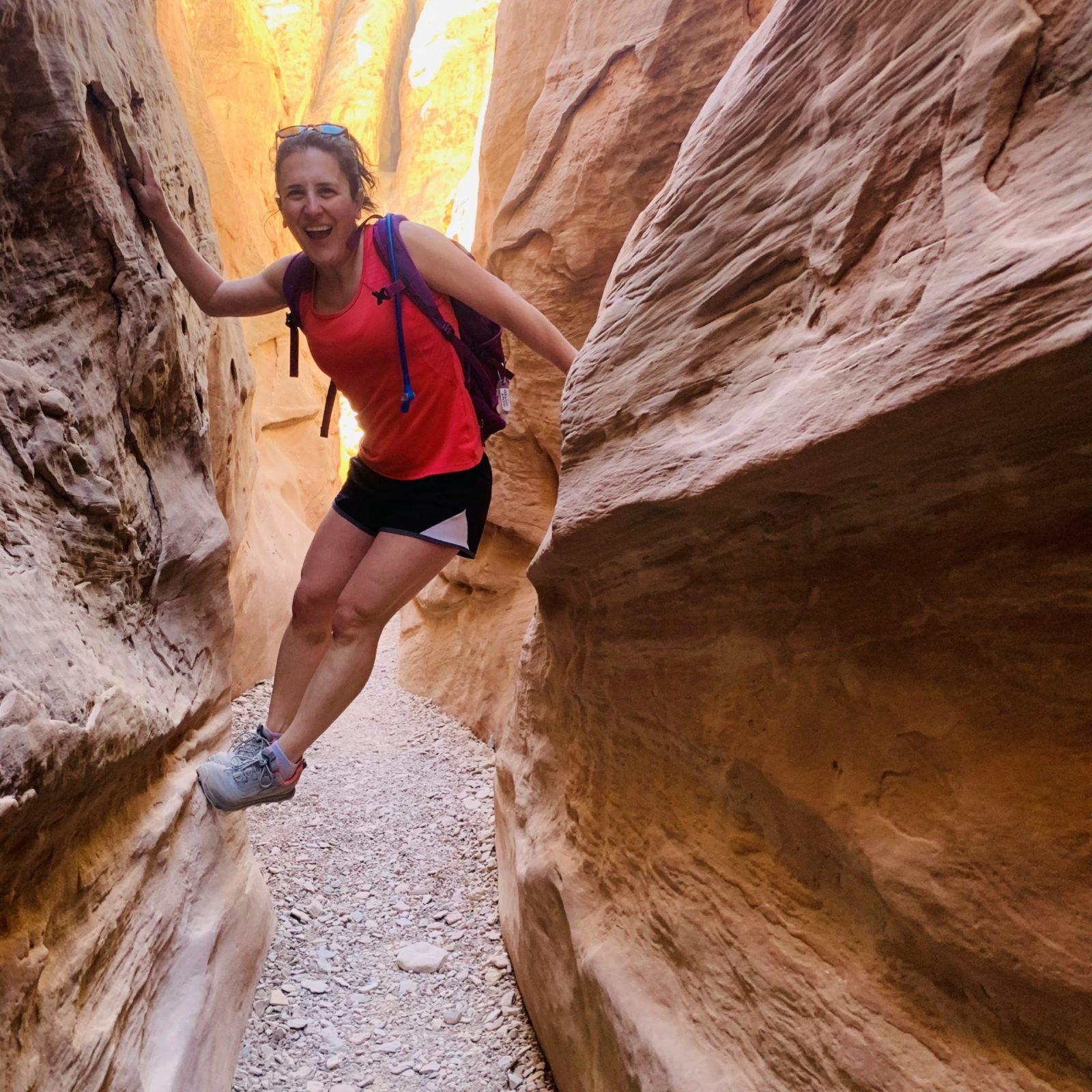 Bridget poised in a slot canyon in Utah. 