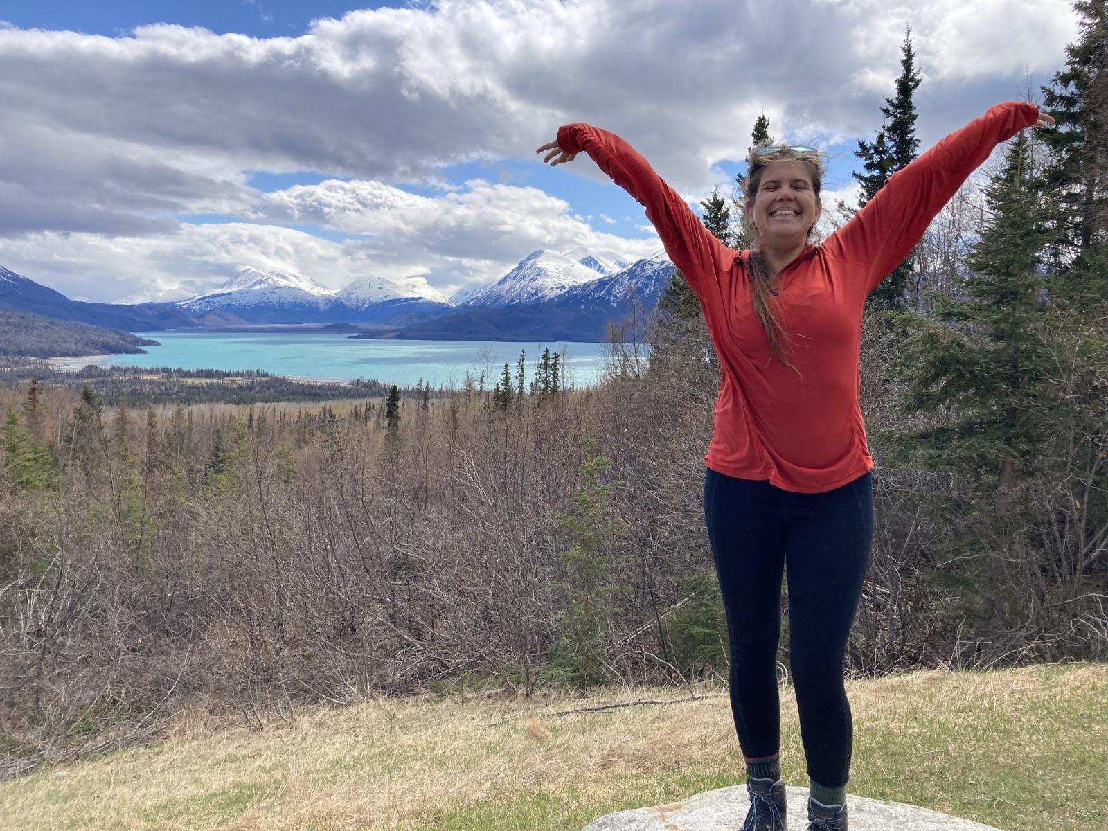 Drinks with lawyers with Rachel, here with her arms stretched out in the Kenai Refuge spring 2023. 